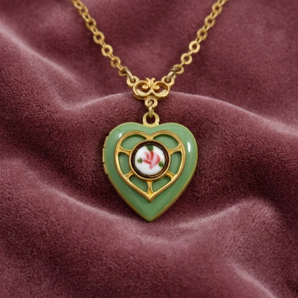 Green and Gold Tone Artisan Heart Picture Locket Pink Rose Necklace on dark pink fabric