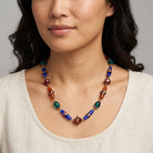 Woman in a light top wearing a Bohemian Multi Color Beaded Necklace 