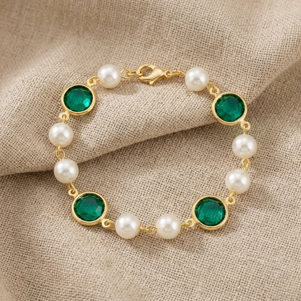 Emerald Green Channel Austrian Crystal & Faux Pearl Link Bracelet displayed on a textured beige linen fabric background.