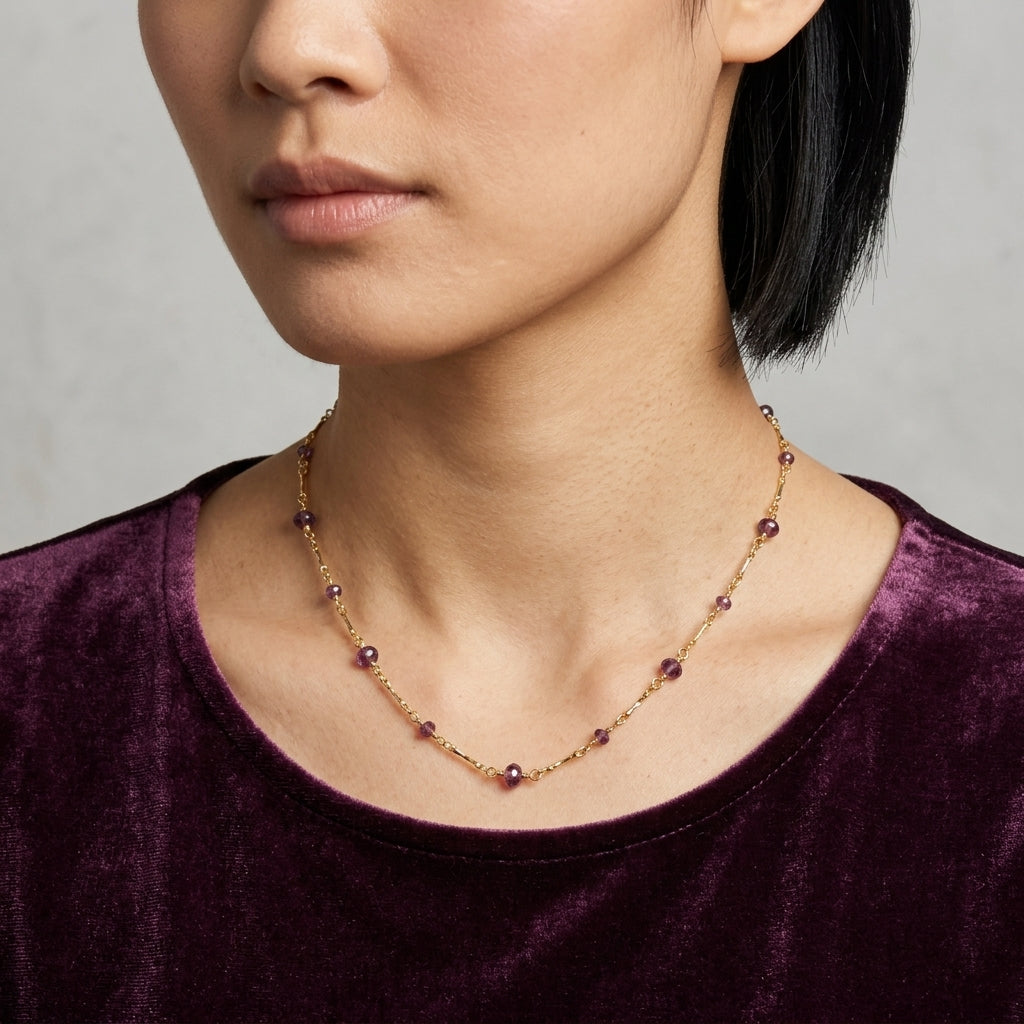 Woman wearing a purple velvet top and a Purple Beaded Chain Necklace