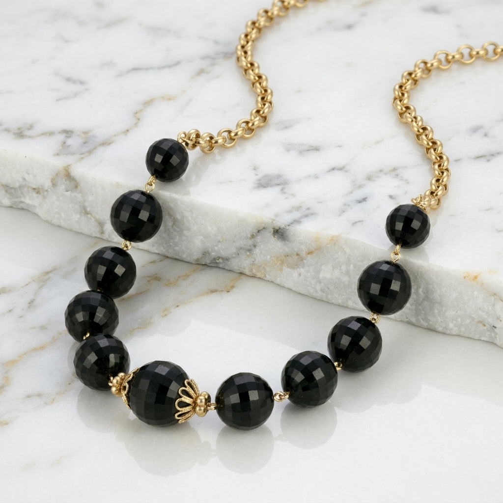 Round Square Cut Black Beaded Necklace on white marble surface