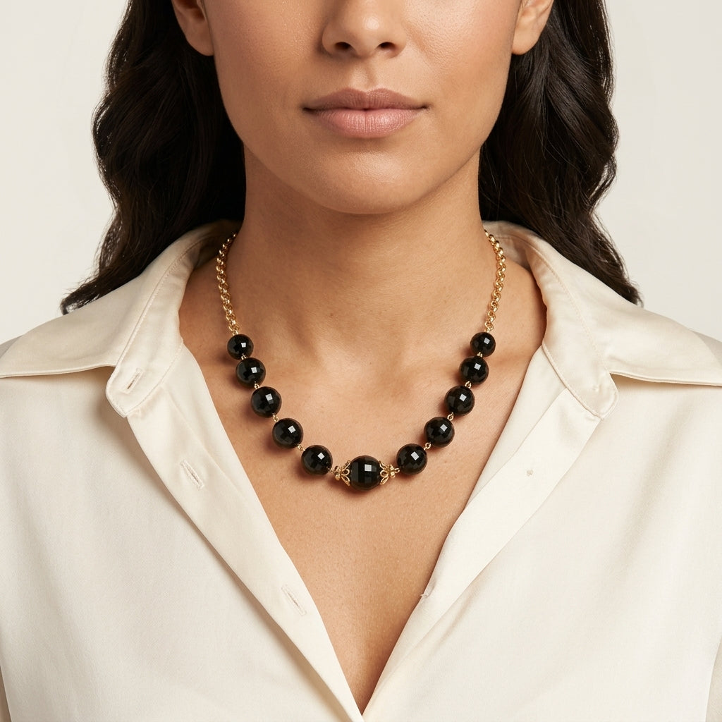 Woman in a white top wearing a Round Square Cut Black Beaded Necklace
