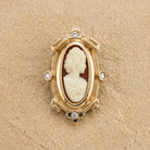 Women With Rose Carnelian Cameo Oval Pin on a beige background