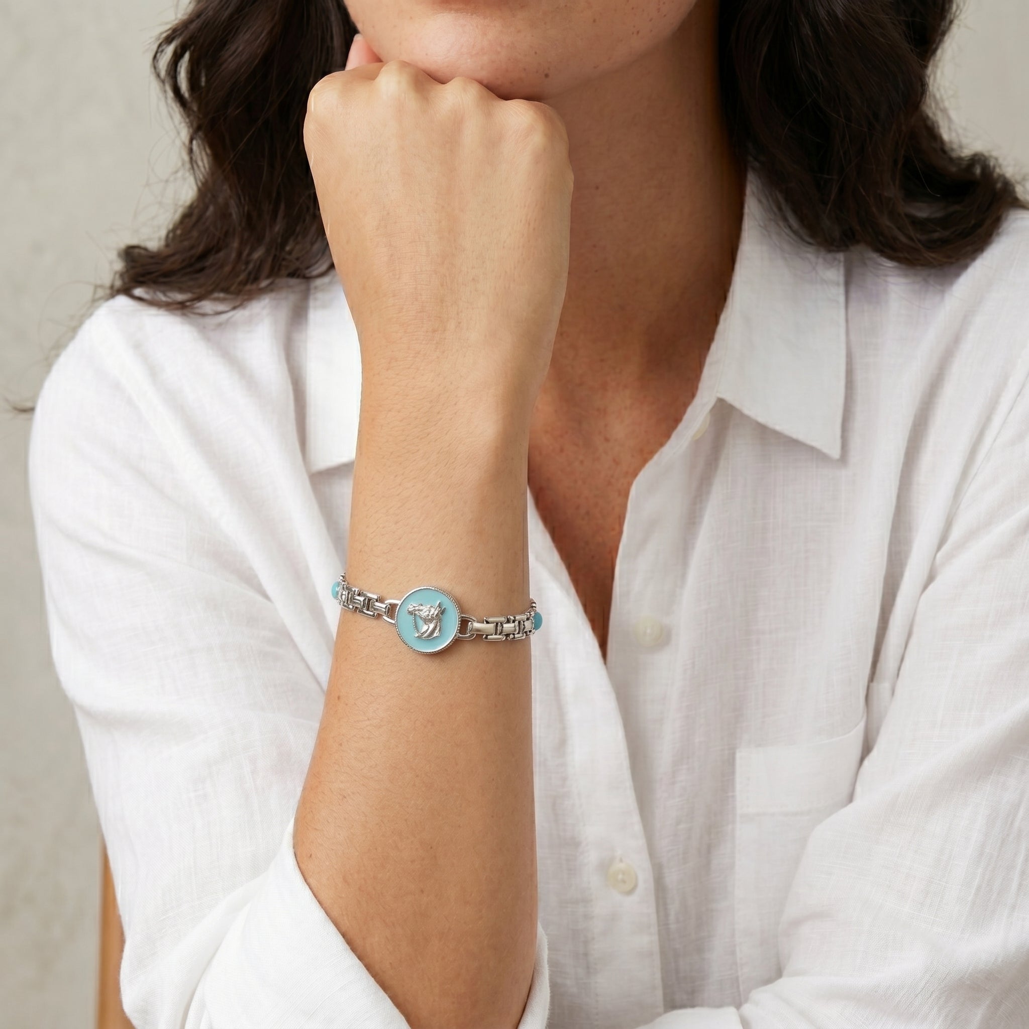 Woman wearing a Southwest Turquoise Horse Head Brick Chain Bracelet