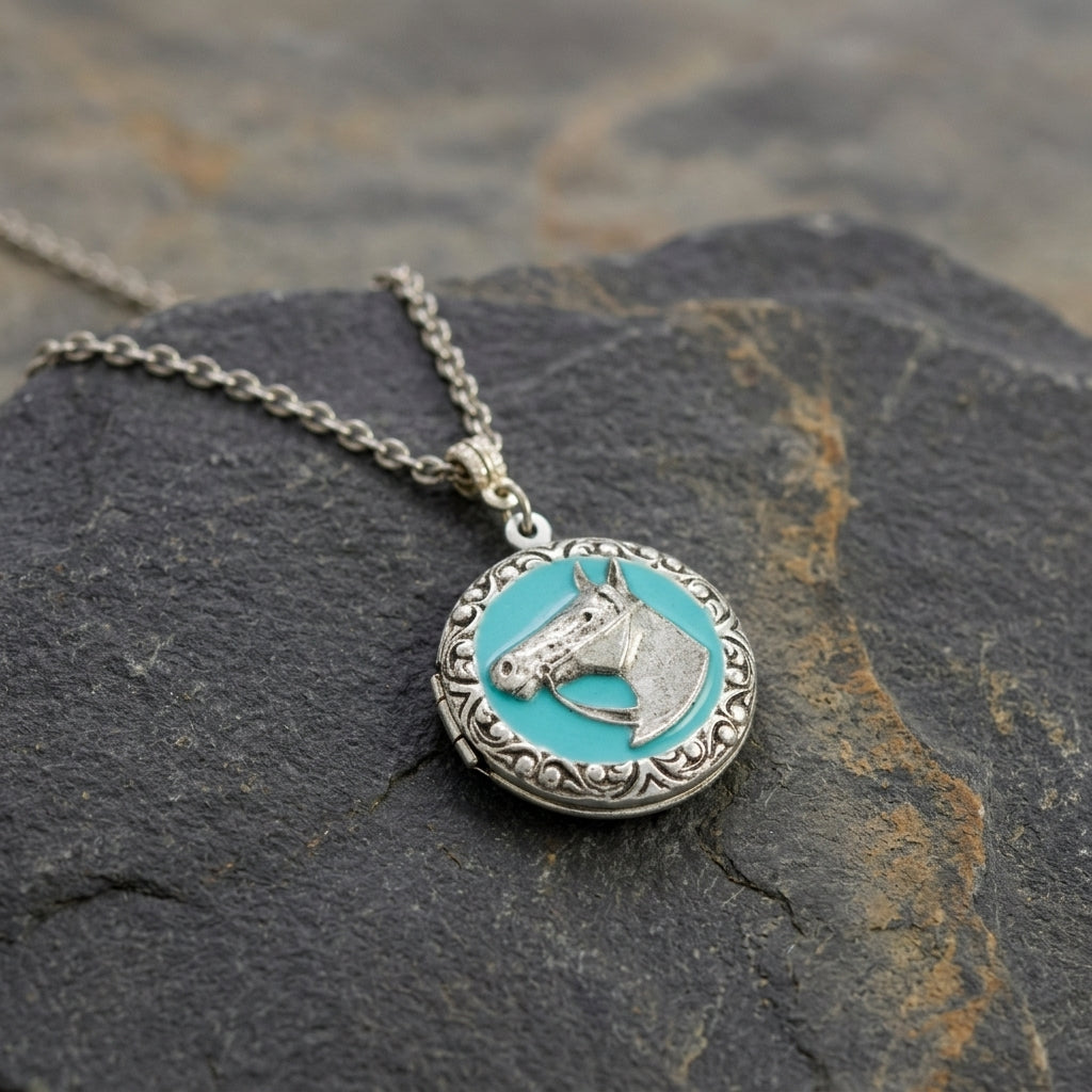 Southwest Turquoise Enamel Horse Head Round Locket Necklace on a textured stone surface