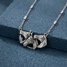 Silver Horse Herd Pendant Necklace on a textured blue background