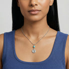 Woman wearing a blue top and a Southwest Turquoise Bead Horse Head Pendant Necklace