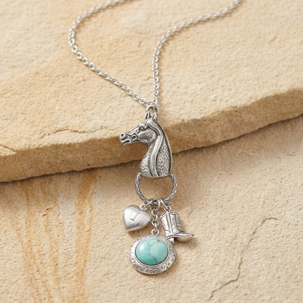 Southwest Horse Head Turquoise Locket & Charms Necklace on beige stone surface