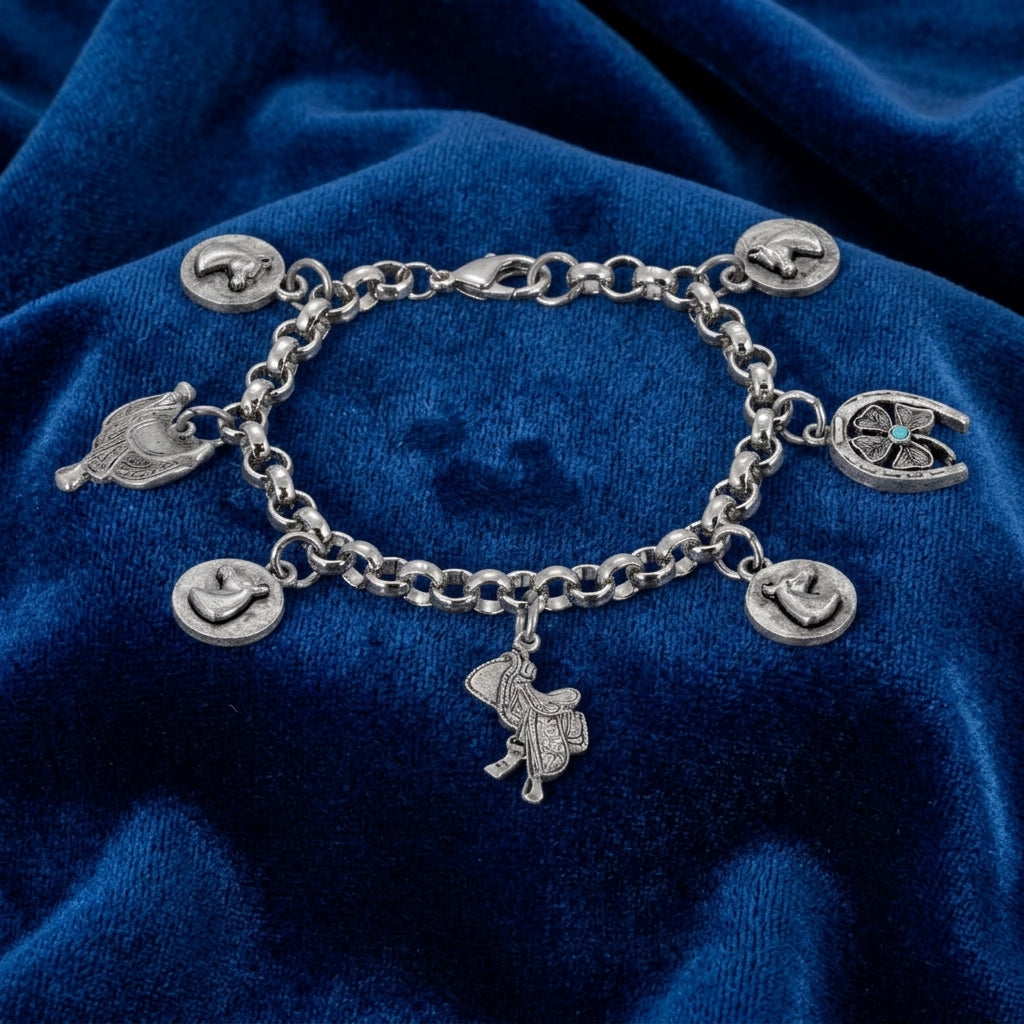 Silver charm equestrian bracelet on a blue fabric background