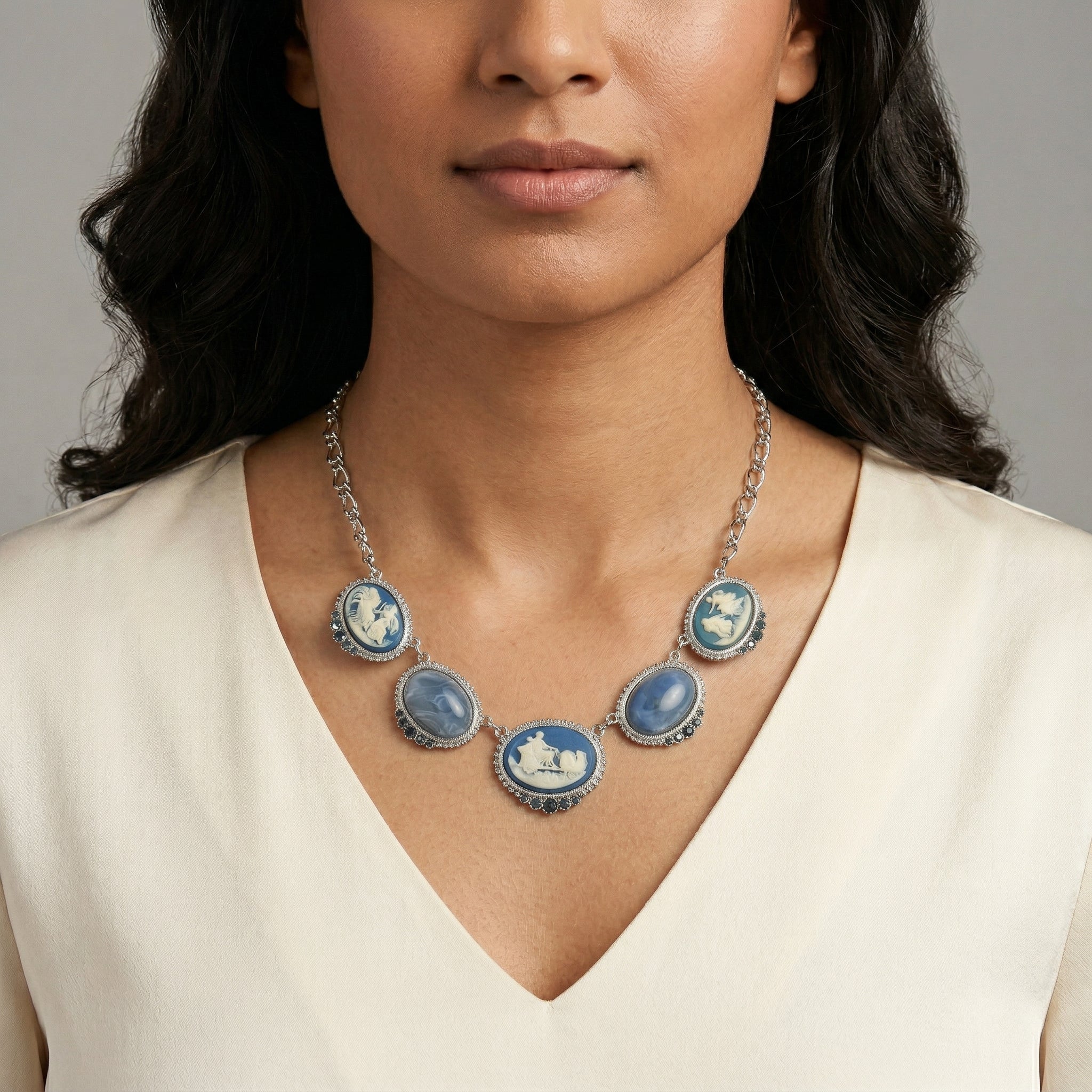 Woman wearing a Roman Chariot Races Cameo Blue Stone Chain Necklace