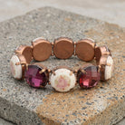 Vintage Floral Round Stone Stretch Bracelet on a textured stone surface