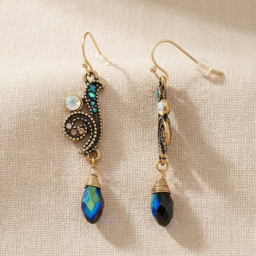 Peacock Plumage Blue Iridescent AB Glass Drop Bead Fish Hook Earrings on a beige fabric background