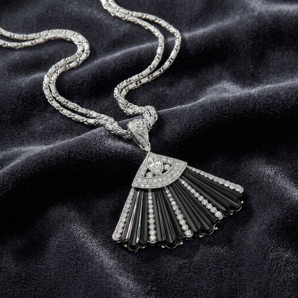 Deco Fantasy Black Stone & Crystal Fan Pendant Necklace on a dark fabric background