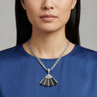 Woman wearing a blue top with our Deco Fantasy Black Stone & Crystal Fan Pendant Necklace