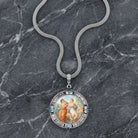 Blue Crystal Rubenesque Glass Pendant Mesh Necklace on a dark marble surface