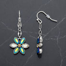 Peacock Plumage Blue Iridescent AB Glass Flower Dangle Earrings on a dark gray background