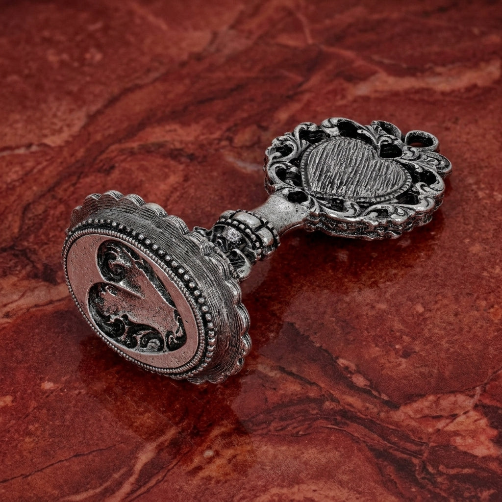 Filigree Heart Wax Seal Stamp on a red marbled background