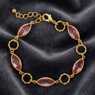 Light Rose Pink Austrian Crystal Round Link Bracelet on a dark fabric background