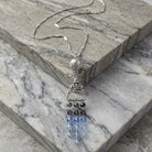 Multi Crystal Chandelier Ornamental Pendant on marble surface