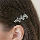 Woman wearing a Small Antiqued Horse Herd Hair Barrette