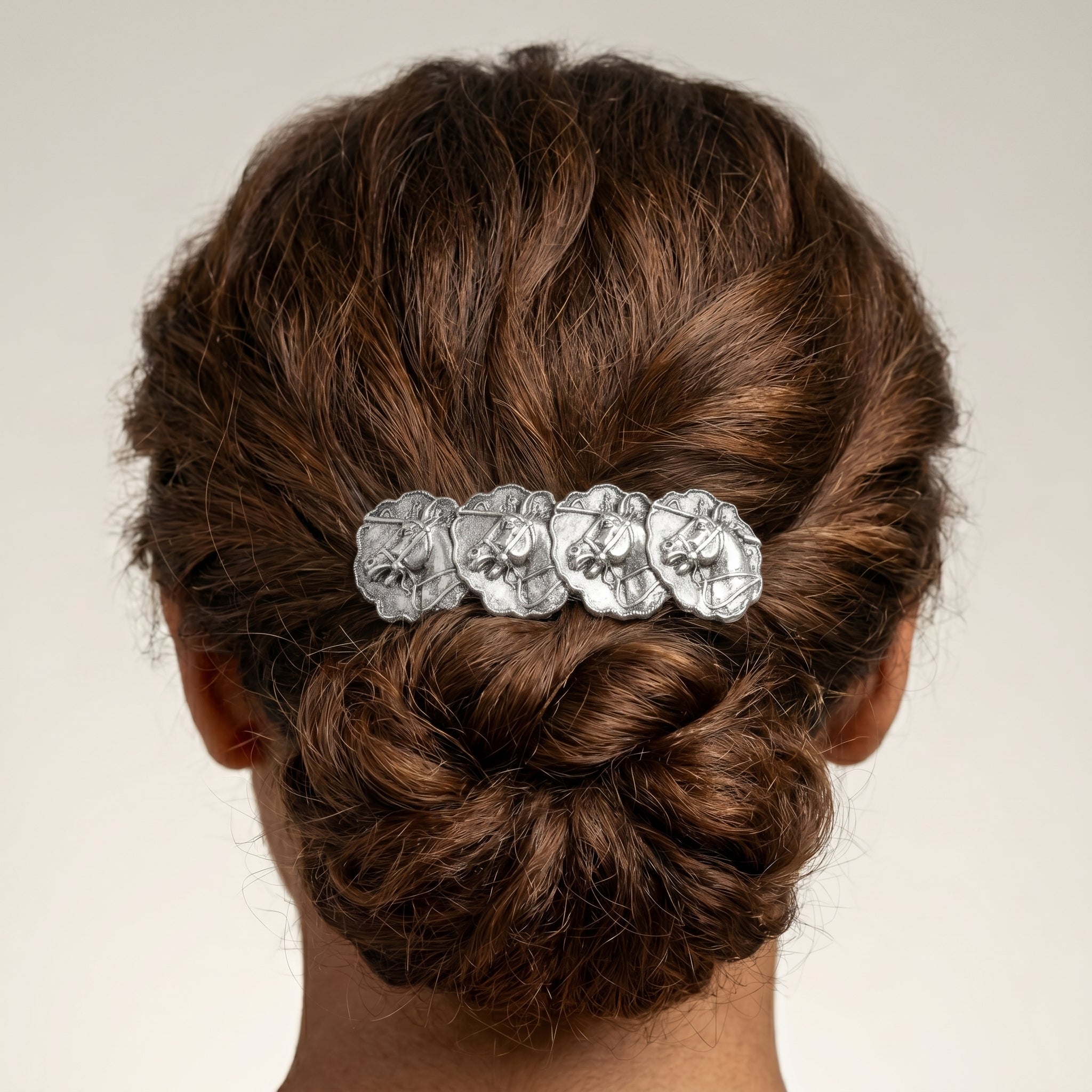 Hair bun with a decorative Equestrian Race Horses Antiqued Hair Barrette