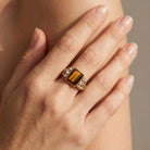 Hand wearing a Tigers Eye Gemstone Crystal Accent Ring