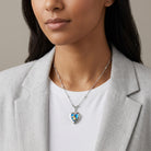 Woman wearing a Sapphire Blue Horse Heart Locket Necklace