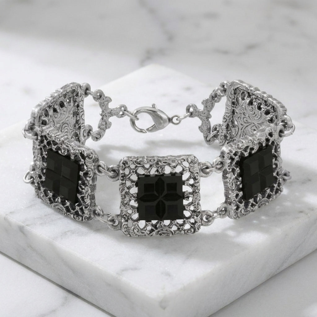 Deco Filigree Square Glass Stone Bracelet resting on white marble surface