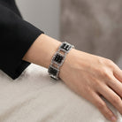 Silver tone Deco Filigree Square Glass Stone Bracelet on a woman's wrist