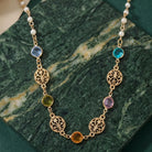 Multicolor Euro Channel Crystal Faux Pearl Necklace on green marble