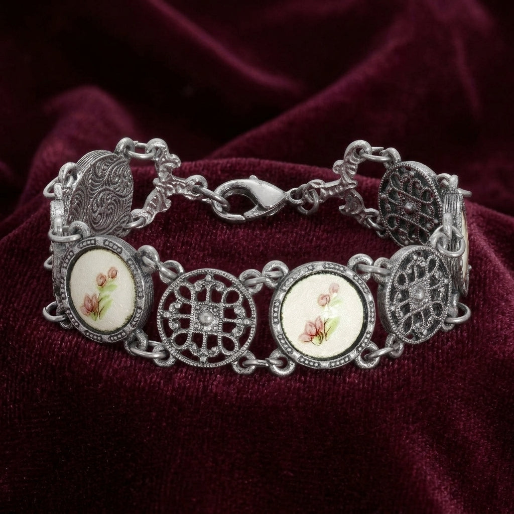 Meso Round Intricate Filigree Pink & White Stone Link Bracelet on dark red fabric