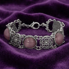 Meso Round Intricate Filigree Purple Amethyst Quartz Glass Link Bracelet on purple fabric