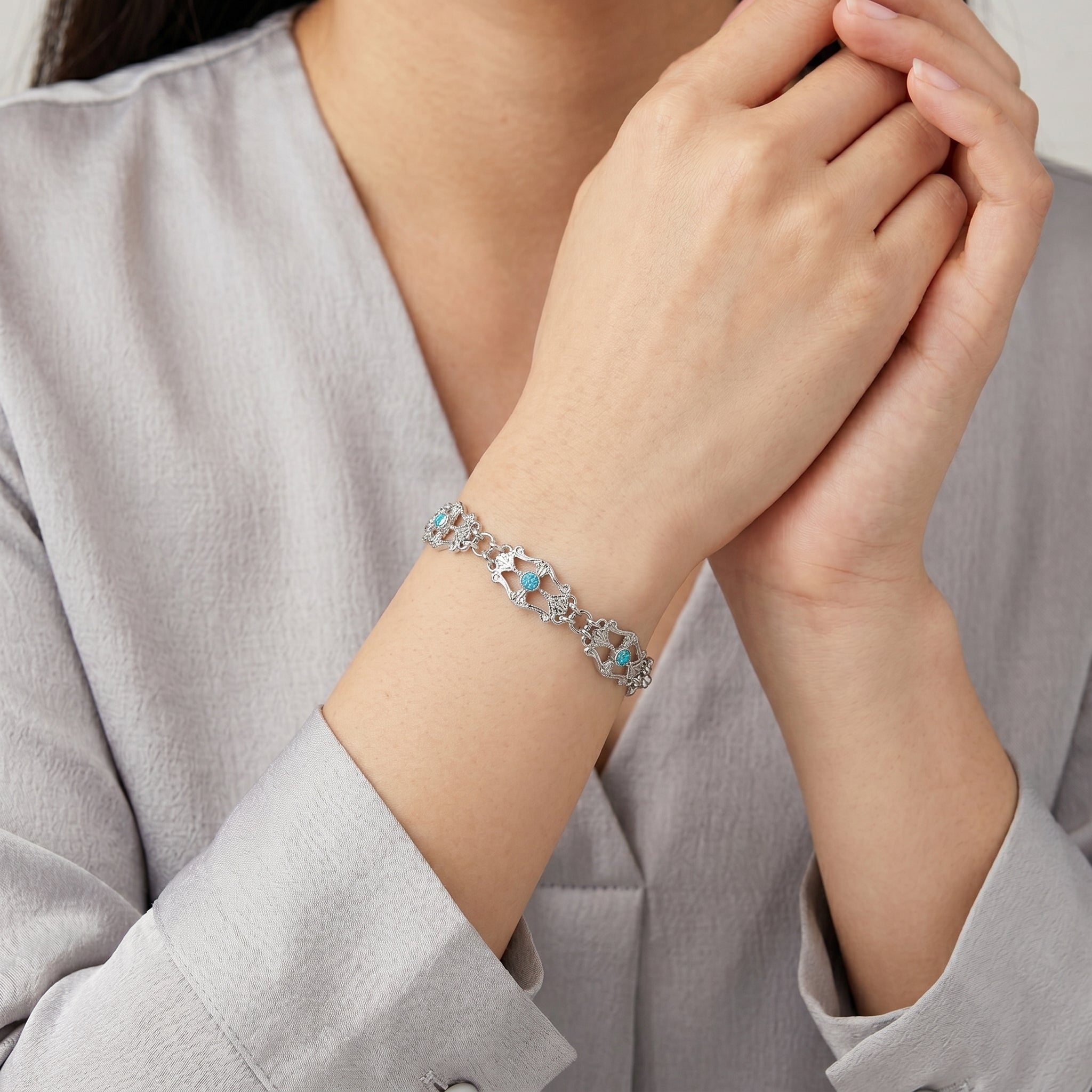 Woman wearing Deco Flare Aqua Blue Crystal Link Bracelet
