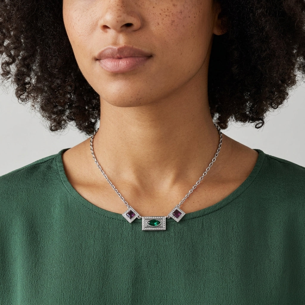 Vivida Multi Austrian Crystal Drop Necklace worn by a woman in a dark green top 