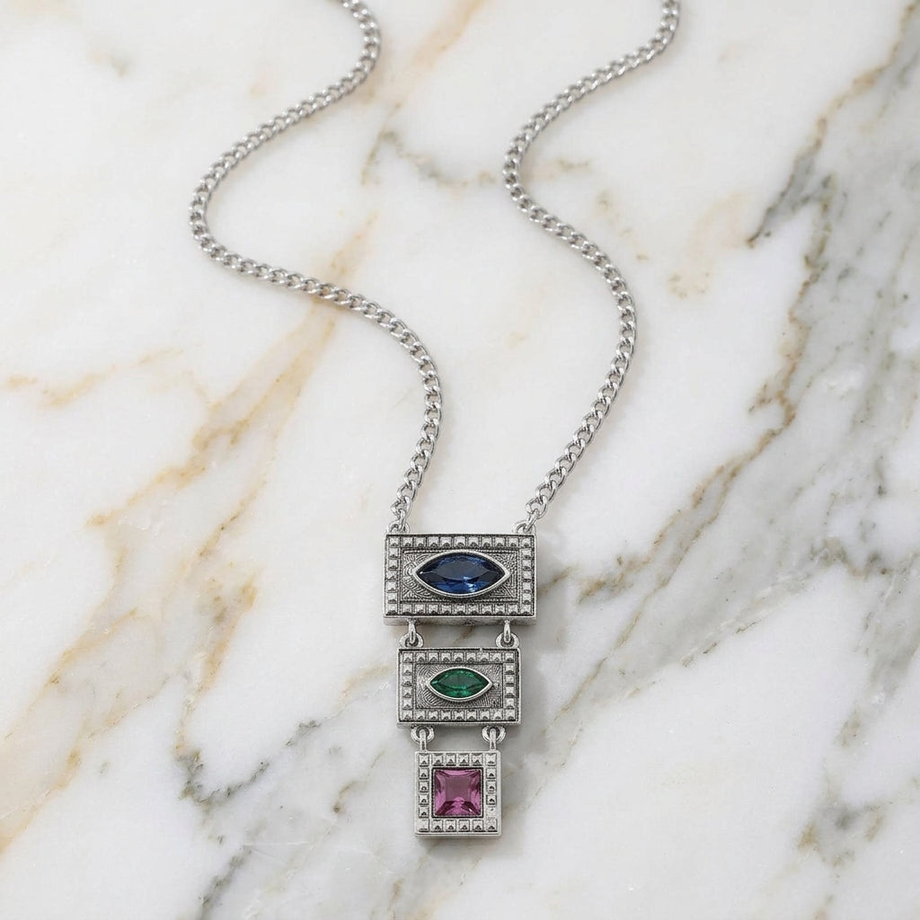 Multi Austrian Crystal Linear Drop Pendant Necklace on a marble surface