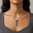 Multi Austrian Crystal Linear Drop Pendant Necklace worn by a woman with a gray top 