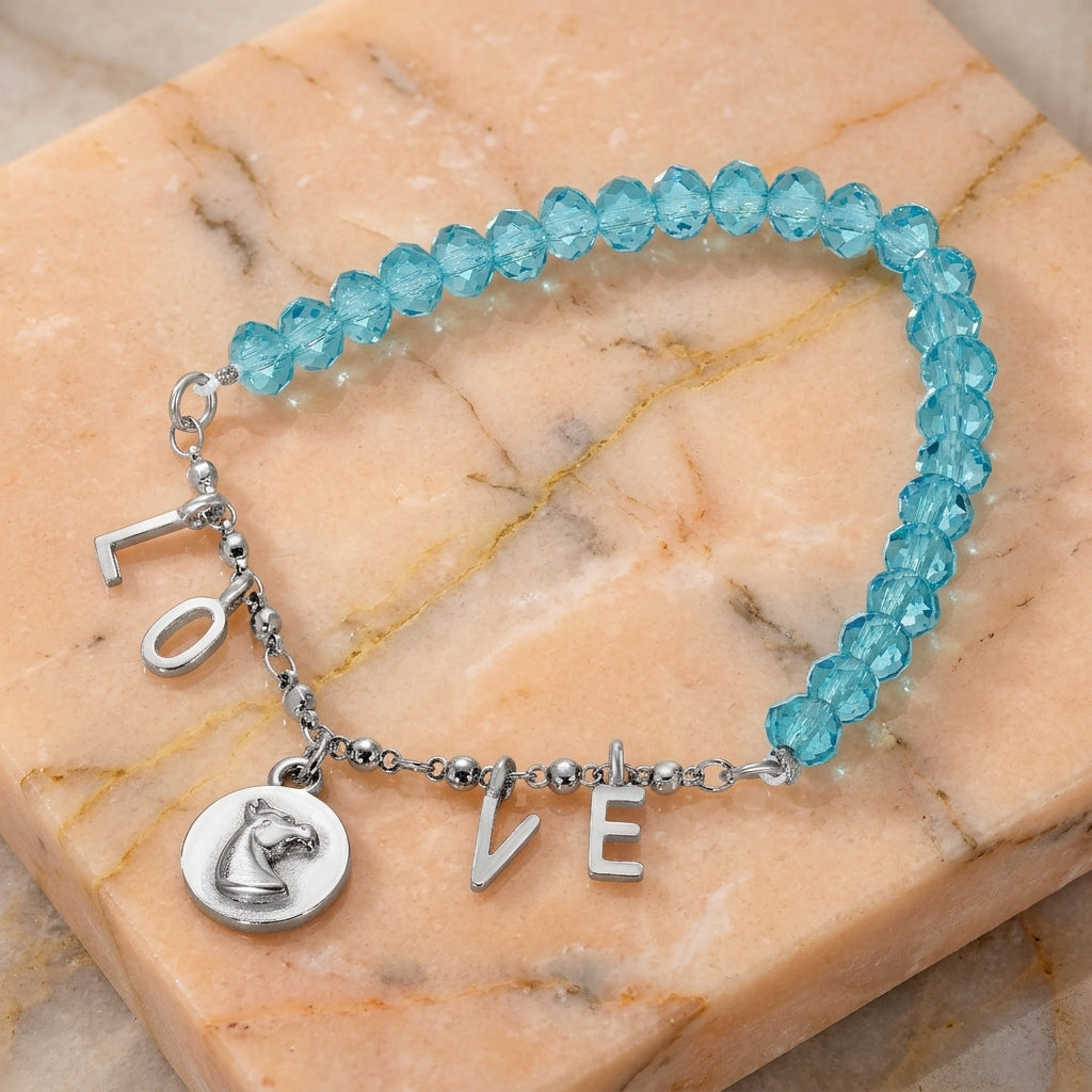 Horse Head LOVE Charm Aqua Bead Stretch Bracelet on peach marble surface
