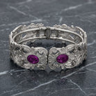Vienna European Crystal Hinge Cuff Bracelet with amethyst crystal resting on gray marble surface