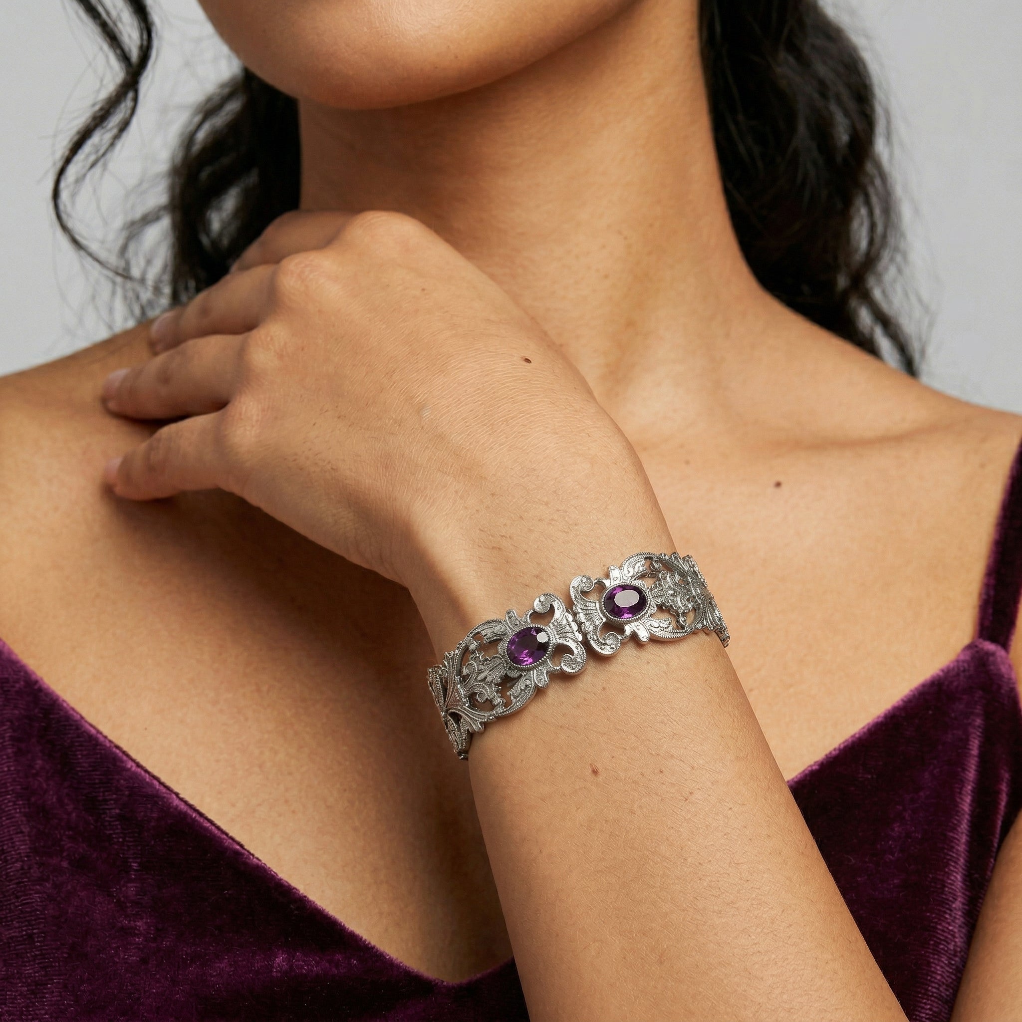Silver Vienna European Crystal Hinge Cuff Bracelet worn by a woman in a purple dress