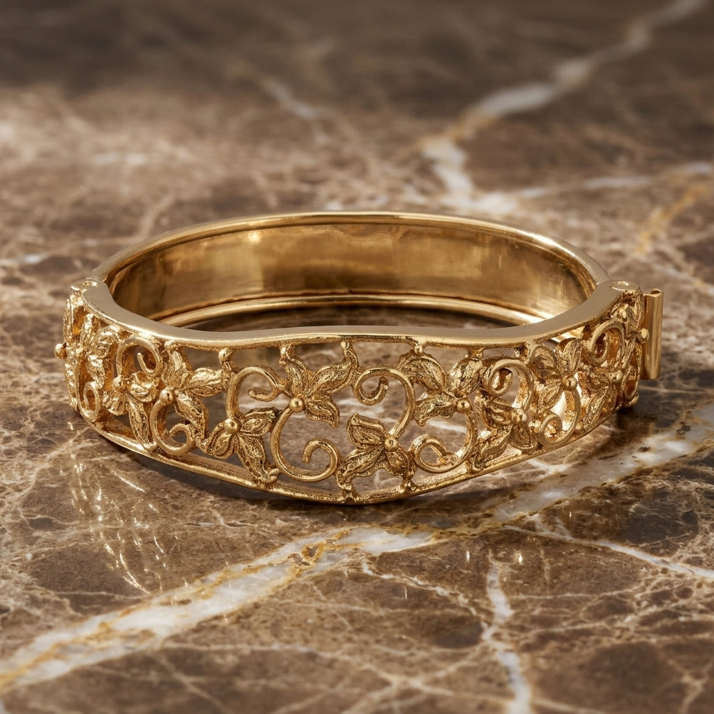 Gold Floral Hinge Bracelet resting on marble surface