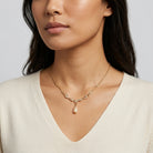 Edwardian Teardrop Faux Pearl Crystal Necklace 16" + 3" Extender worn by a woman in a white top