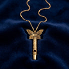 Gold Filigree Whistle Butterfly Pendant Necklace resting on dark blue fabric