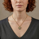 Person wearing Heart And Paw Crystal Accent Pendant Necklace against a neutral background