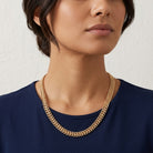 Woman wearing a Gold Tone Double Curb Chain Necklace
