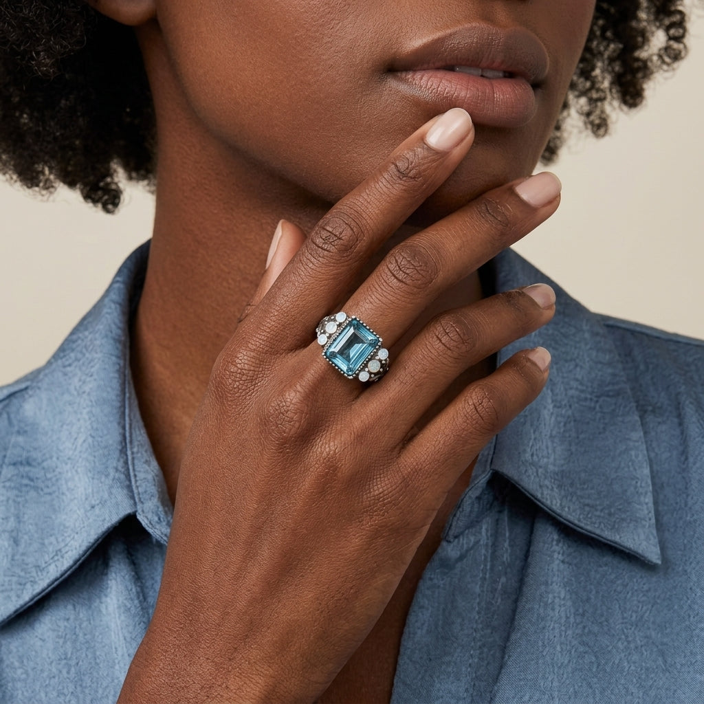 Woman wearing a Aquamarine Crystal Rectangular Blue Crystal Opal Stone Ring on her finger