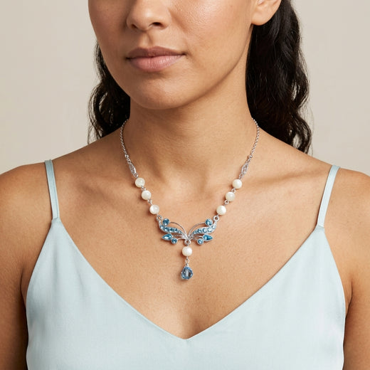 Woman wearing our Aquamarine Crystal Mother Of Pearl Drop Necklace