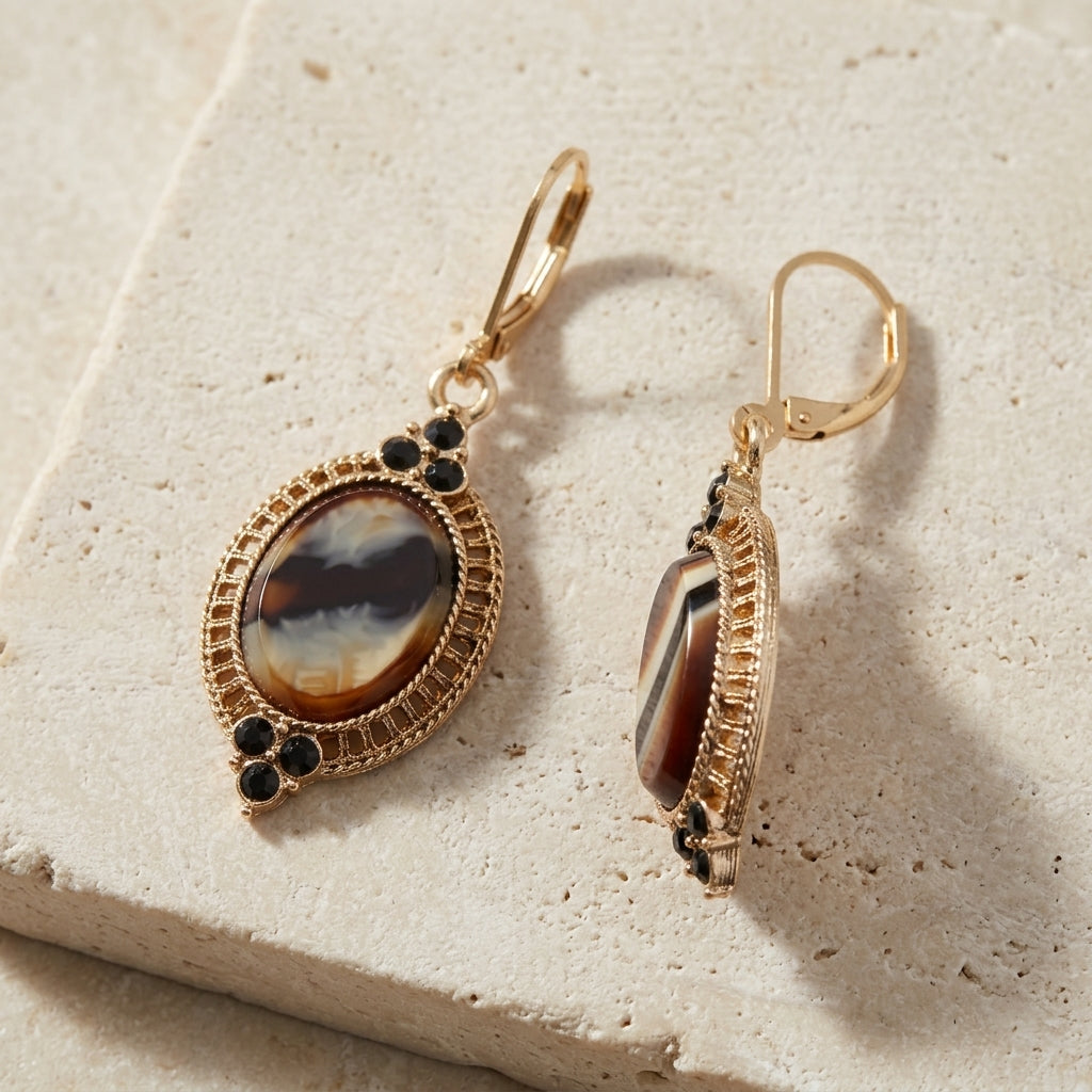 Tigers Eye Glass Stone Drop Earrings resting on limestone