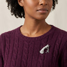 Woman in a maroon sweater wearing our Belle Epoch Victorian Hand Model Crystal Initial Pin