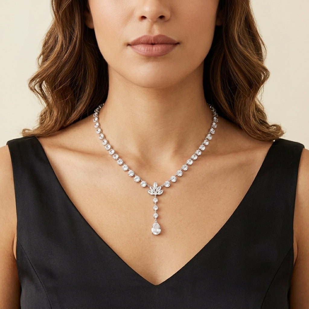 Teardrop genuine Austrian Crystal necklace worn by a woman in a black dress against a neutral background.
