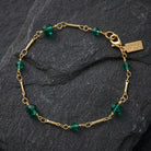 Faceted Crystal Beaded Chain Bracelet on black stone surface